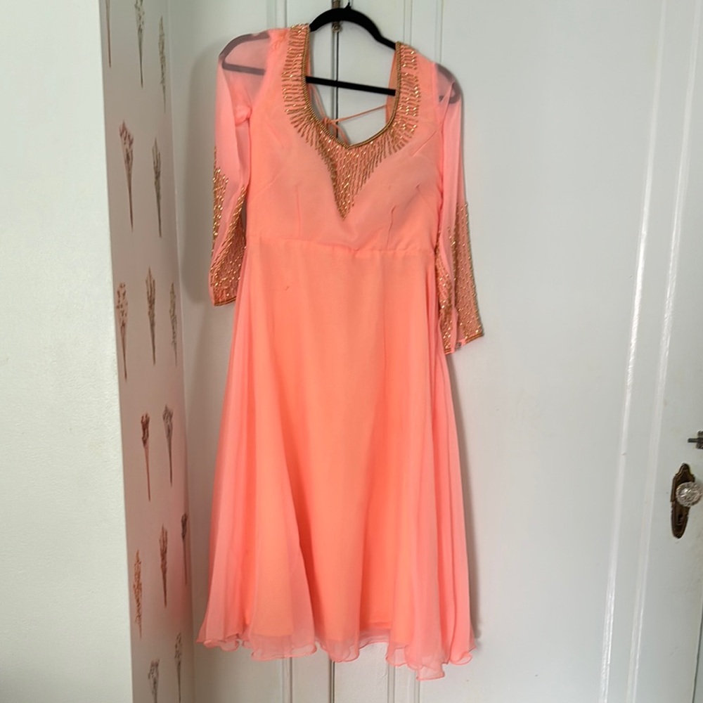 Elegant Peach Dress with Gold Accents